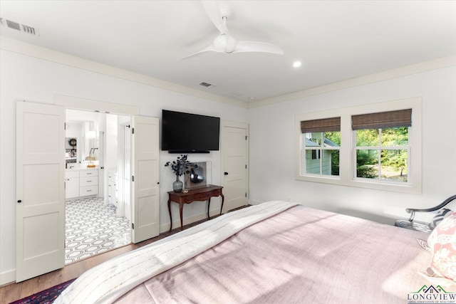 378 Cypress Creek Dr, Mount Vernon, TX 75457 - bedroom with wood finished floors, ensuite bathroom, and a ceiling fan