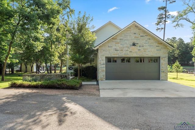 378 Cypress Creek Dr, Mount Vernon, TX 75457 - view of front facade featuring stone siding, driveway, and a garage