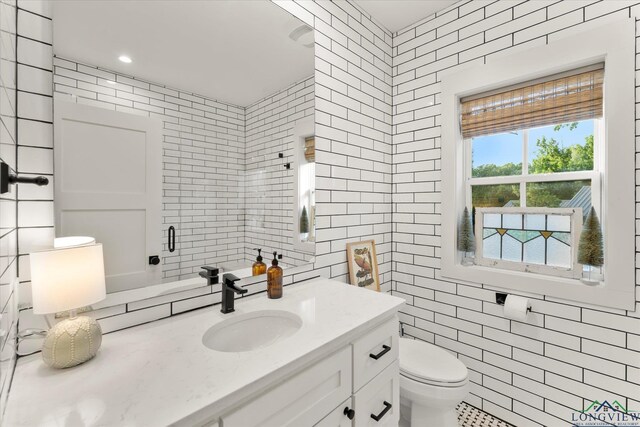 378 Cypress Creek Dr, Mount Vernon, TX 75457 - bathroom featuring tile walls and vanity