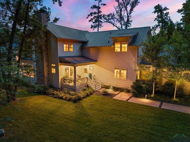 378 Cypress Creek Dr, Mount Vernon, TX 75457 - view of front of home featuring a standing seam roof, a chimney, a metal roof, and a front lawn