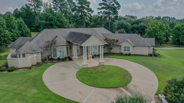 ranch-style house featuring a porch and a front yard