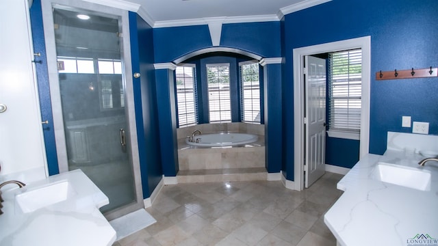 bathroom with tile patterned flooring, vanity, crown molding, and independent shower and bath