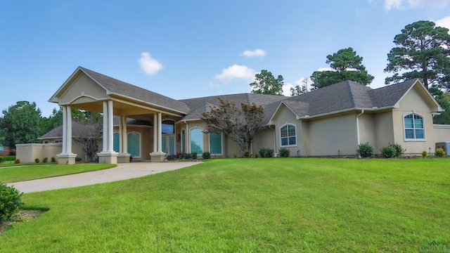 single story home with central air condition unit and a front lawn