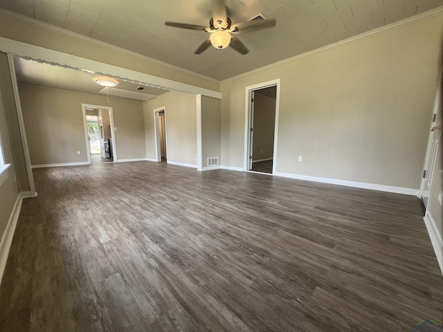 714 W Quitman Ave, Gladewater, TX 75647 - empty room featuring dark wood finished floors, a ceiling fan, baseboards, and crown molding