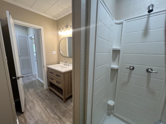 714 W Quitman Ave, Gladewater, TX 75647 - full bathroom with ornamental molding, wood finished floors, vanity, and a shower