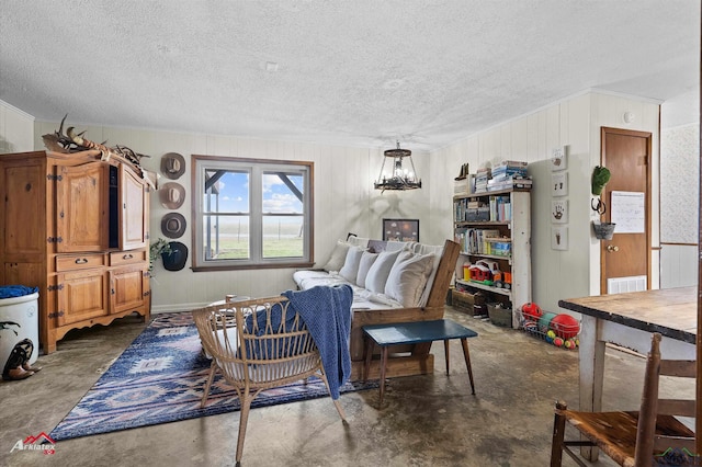 interior space with unfinished concrete floors and a textured ceiling