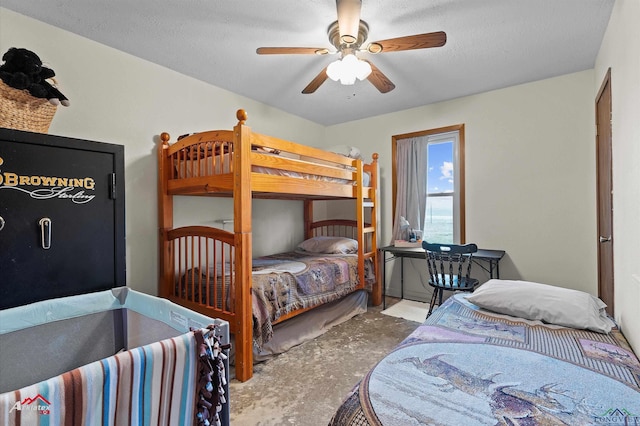 bedroom featuring a textured ceiling and a ceiling fan