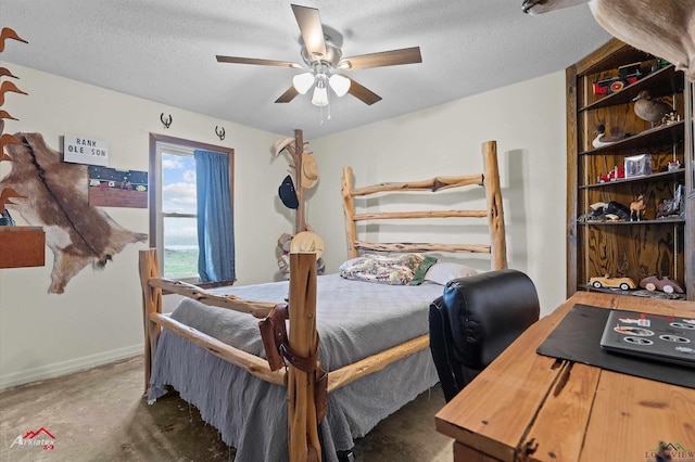 bedroom featuring a textured ceiling and ceiling fan