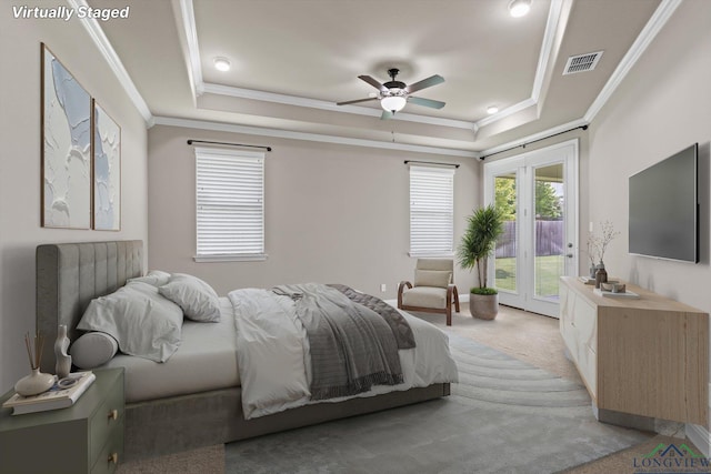 3363 Celebration Way, Longview, TX 75605 - bedroom featuring access to exterior, crown molding, a tray ceiling, light colored carpet, and a ceiling fan