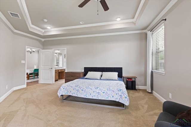 bedroom featuring visible vents, crown molding, baseboards, light colored carpet, and a tray ceiling