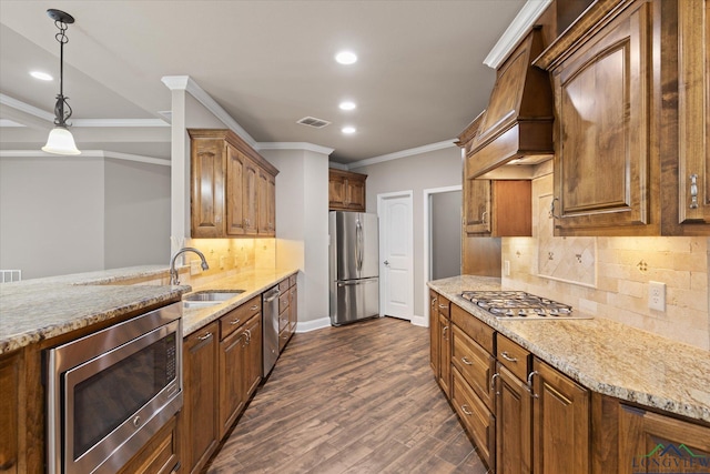 3363 Celebration Way, Longview, TX 75605 - kitchen featuring appliances with stainless steel finishes, recessed lighting, light stone counters, ornamental molding, and custom range hood