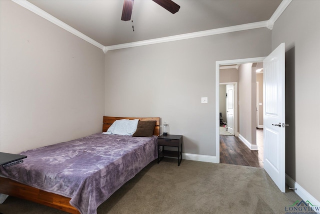 bedroom featuring crown molding, carpet flooring, baseboards, and ceiling fan