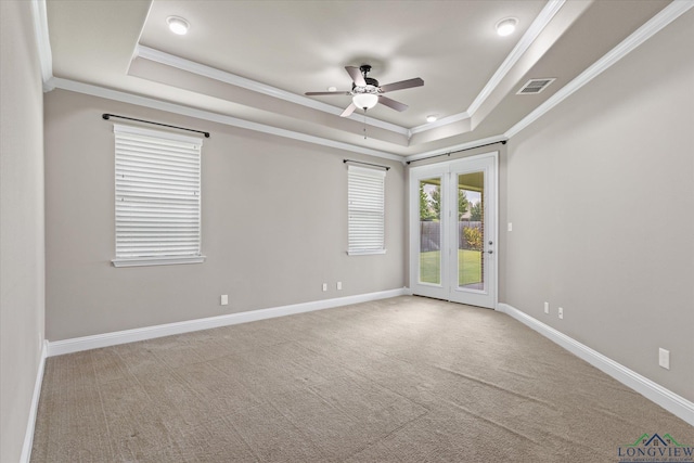 3363 Celebration Way, Longview, TX 75605 - unfurnished room with a tray ceiling, crown molding, a ceiling fan, and carpet