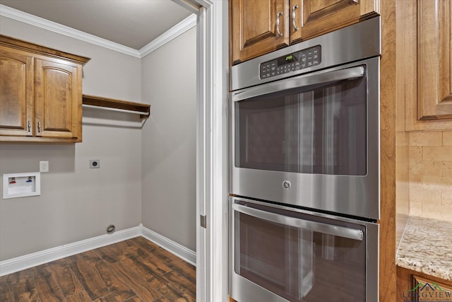 3363 Celebration Way, Longview, TX 75605 - laundry area with cabinet space, ornamental molding, dark wood-style floors, electric dryer hookup, and washer hookup