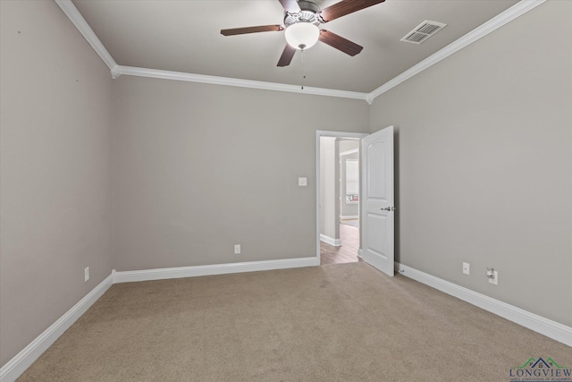 3363 Celebration Way, Longview, TX 75605 - empty room featuring crown molding, light carpet, and a ceiling fan