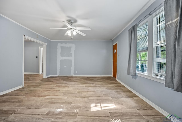 spare room featuring ceiling fan and crown molding