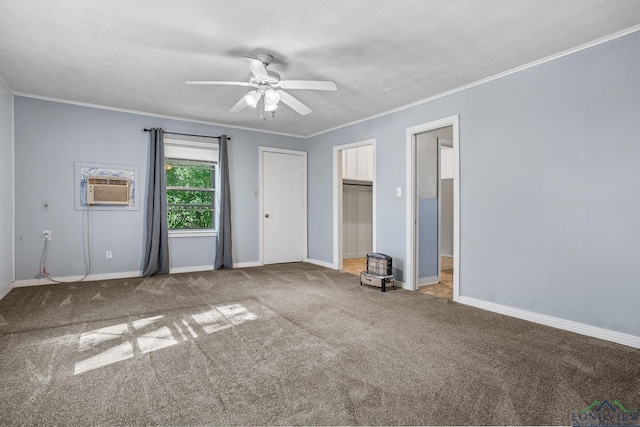 unfurnished bedroom featuring ceiling fan, an AC wall unit, crown molding, and carpet floors