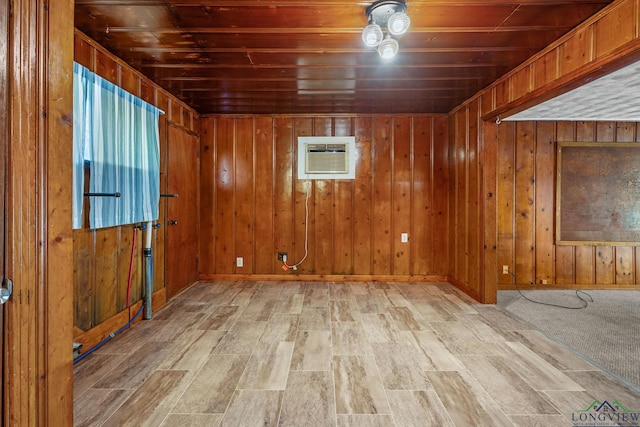 spare room with wood walls, wooden ceiling, and a wall unit AC