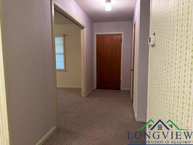 3100 Jane Dr, Longview, TX 75601 - corridor with baseboards and carpet floors