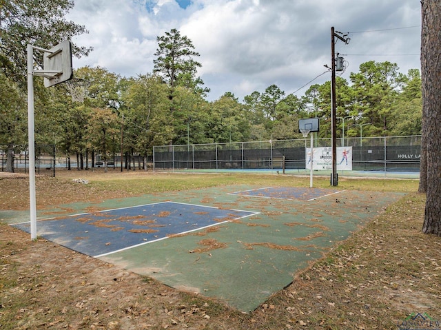 view of sport court featuring community basketball court and fence