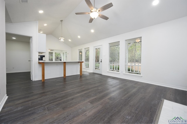 unfurnished living room featuring dark wood-type flooring, recessed lighting, a ceiling fan, and baseboards