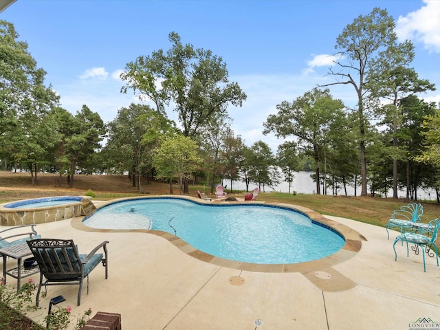 view of swimming pool with an in ground hot tub and a patio