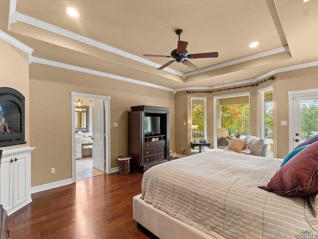 bedroom with access to outside, a raised ceiling, ceiling fan, dark wood-type flooring, and connected bathroom