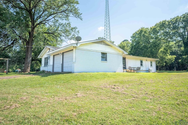 rear view of property with a lawn