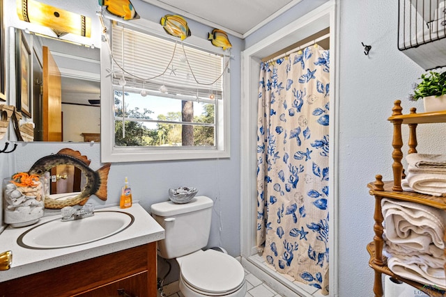 bathroom featuring a shower with curtain, crown molding, vanity, and toilet