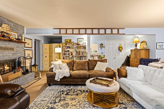 living room featuring a fireplace and light tile patterned flooring