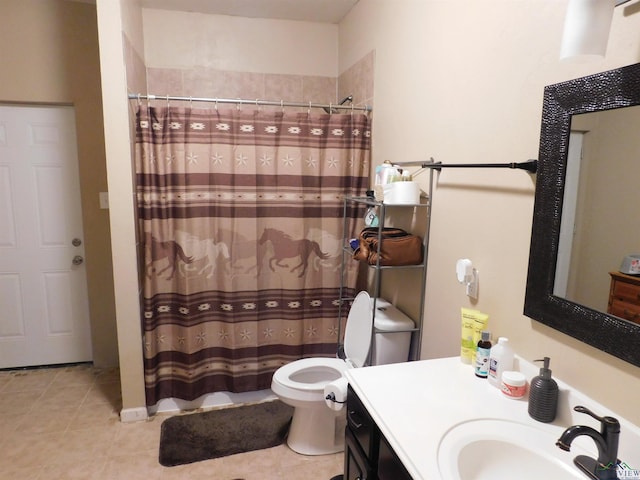 bathroom featuring curtained shower, tile patterned flooring, vanity, and toilet