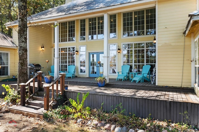 rear view of house featuring a deck