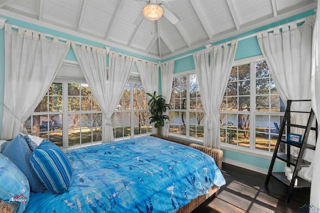 bedroom featuring a water view and lofted ceiling with beams