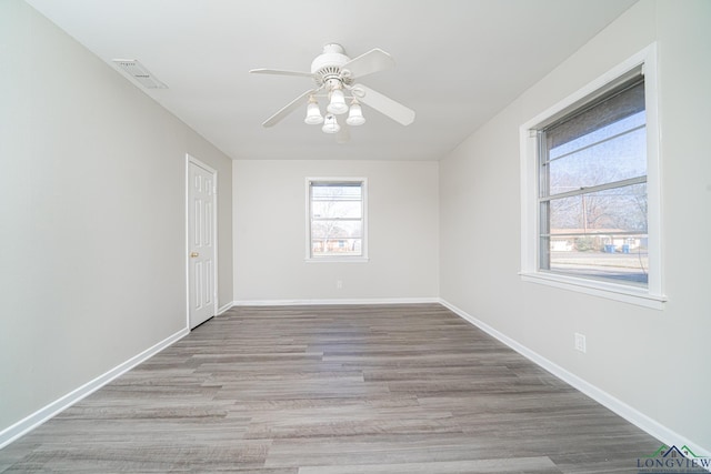 unfurnished room featuring ceiling fan and light hardwood / wood-style floors