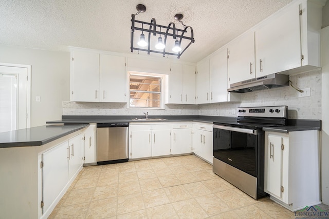 kitchen with white cabinetry, appliances with stainless steel finishes, and decorative light fixtures