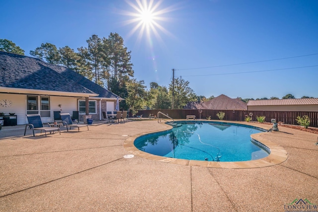 view of pool featuring a patio area