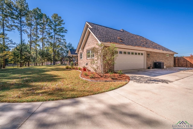 view of property exterior featuring central AC, a yard, and a garage