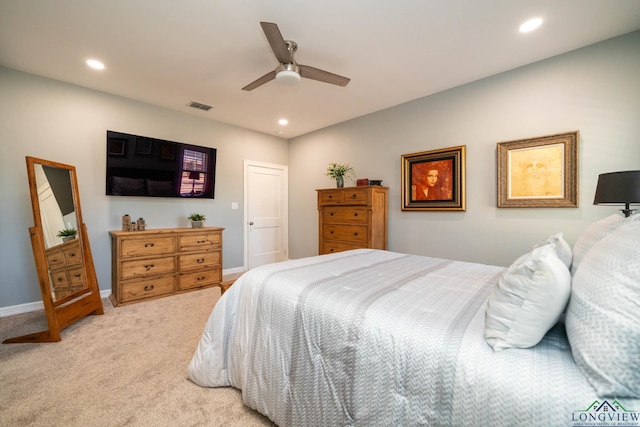 bedroom featuring ceiling fan and light colored carpet