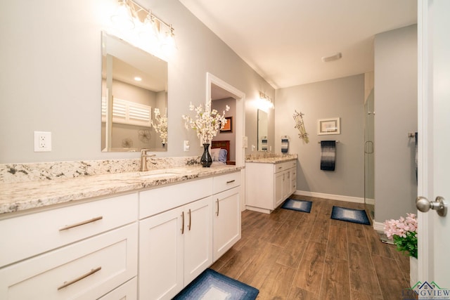 bathroom featuring vanity and walk in shower