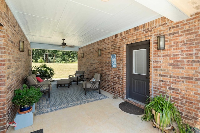 view of patio with ceiling fan and an outdoor living space