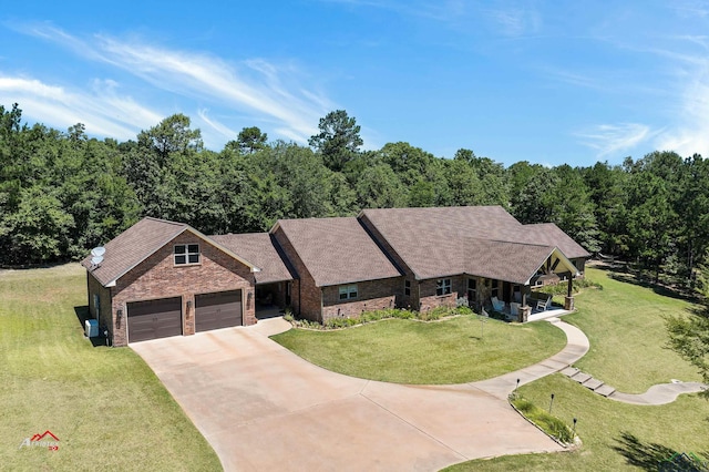 view of front of home featuring a front lawn and a garage