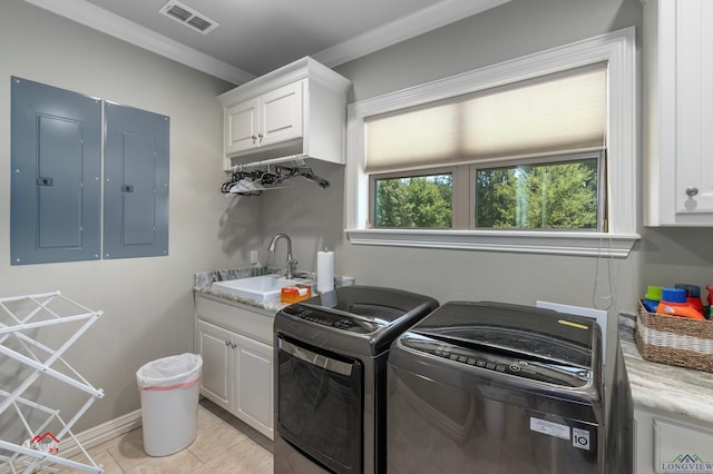 laundry area with cabinets, light tile patterned floors, electric panel, and sink