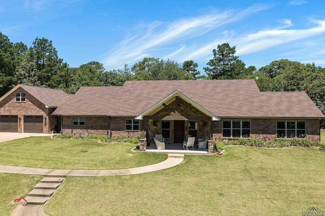 ranch-style home with a porch, a garage, and a front lawn