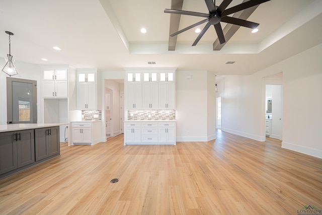 unfurnished living room with ceiling fan and light hardwood / wood-style flooring