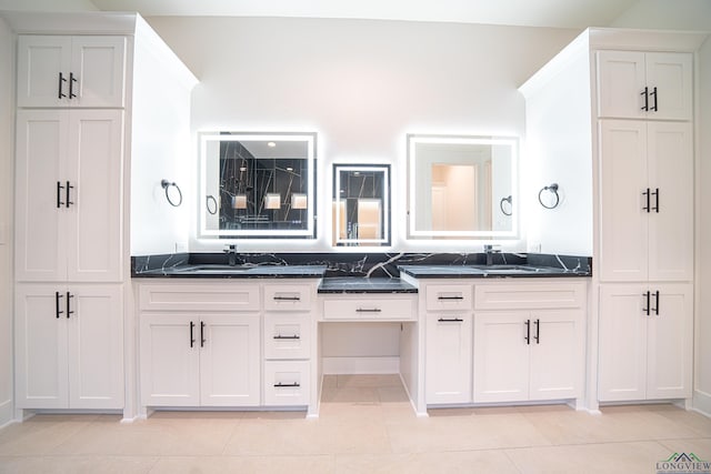 bathroom with tile patterned flooring and vanity