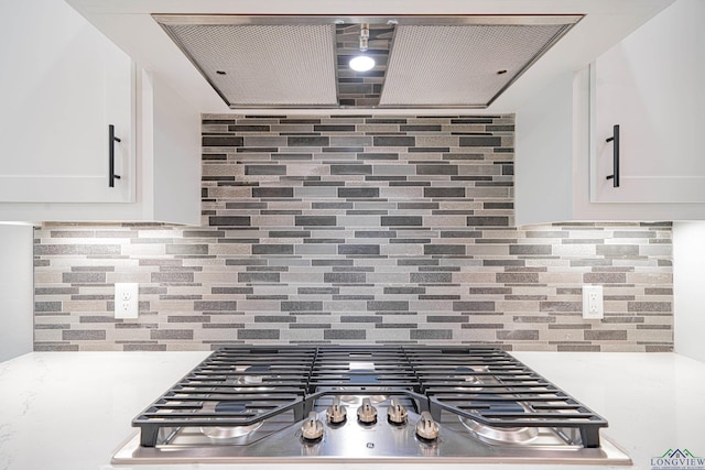 kitchen featuring white cabinetry, stainless steel gas cooktop, and tasteful backsplash