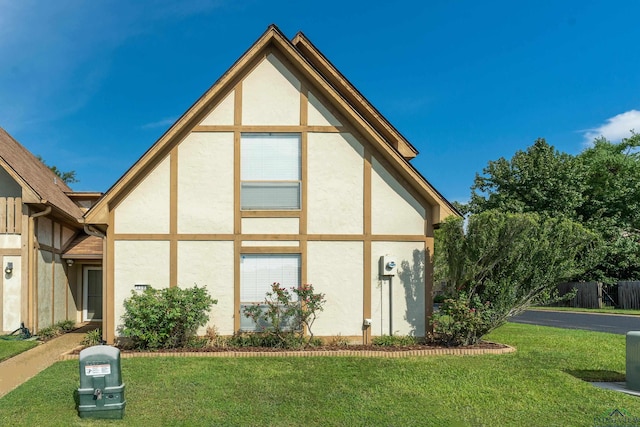 view of home's exterior with a lawn