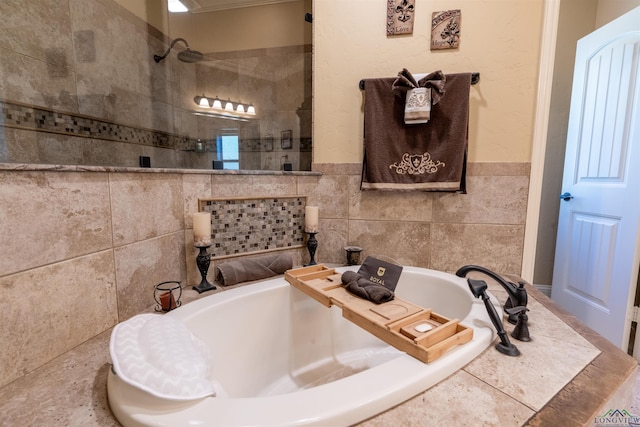 bathroom with tile walls and plus walk in shower