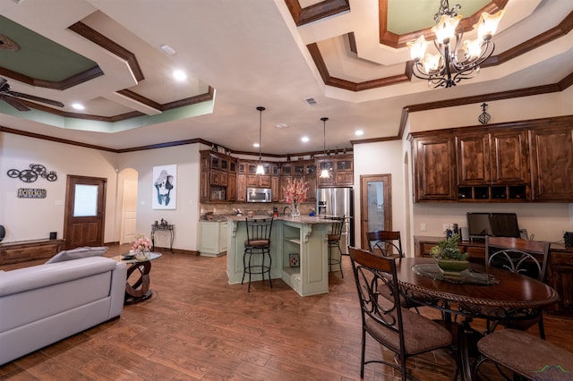 dining room featuring ceiling fan with notable chandelier, dark wood-type flooring, and crown molding