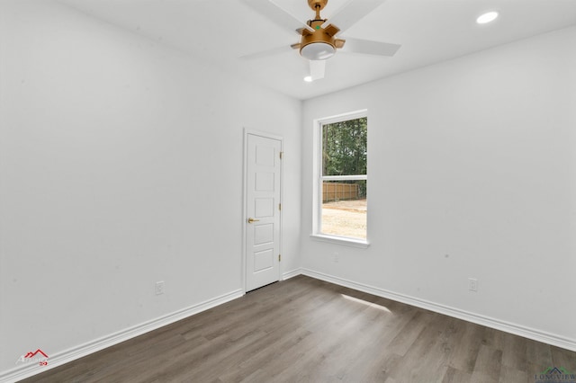 unfurnished room with ceiling fan and hardwood / wood-style flooring